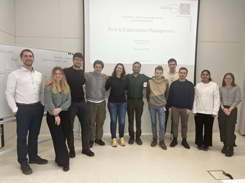 Photograph of Dominik Kemmer with a small group of ChemPrint doctoral researchers during training