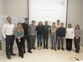 Photograph of Dominik Kemmer with a small group of ChemPrint doctoral researchers during training